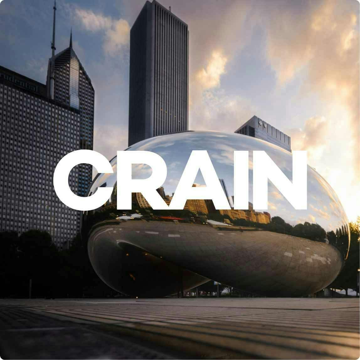 Picture of the Chicago Bean structure in twilight with the Crain logo on top